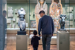 Father and son in an exhibtion hall